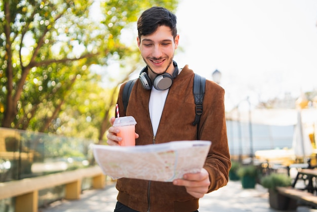 Traveler Man Holding a Map and Looking for Directions – Free Stock Photo, Download Free