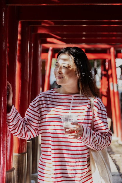 Young Woman Walking Through the Neighborhood – Free Download