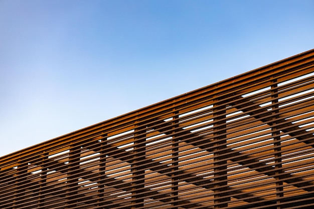 Wooden Slat Shading Structure Against the Sky – Free Download