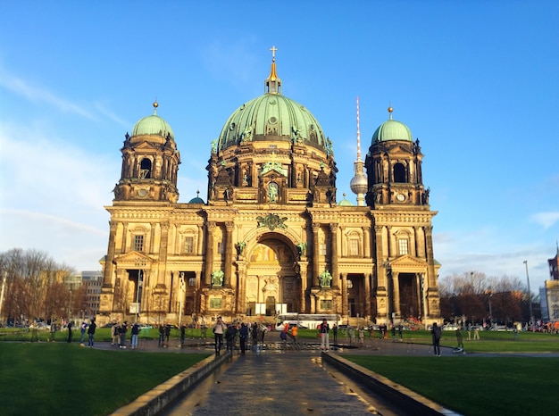 Tourists Visiting Berlin Cathedral Under a Clear Blue Sky – Free Download