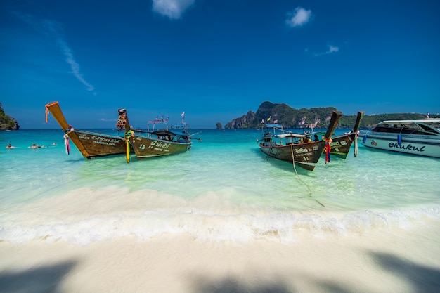 Long Tail Boats at White Sandy Beach on Phi Phi Island in Thailand – Free Download