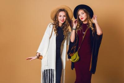 Fall Studio Shot of Two Models in Wool and Straw Hats with Striped Ponchos – Free Stock Photo for Download