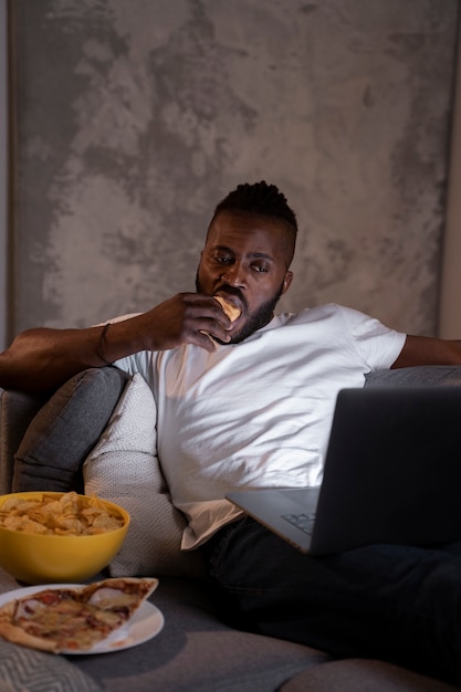 African American Man Enjoying Late-Night Snack – Free Download