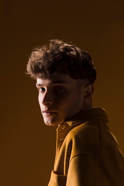 Young Man Portrait in a Yellow Scene – Free Download