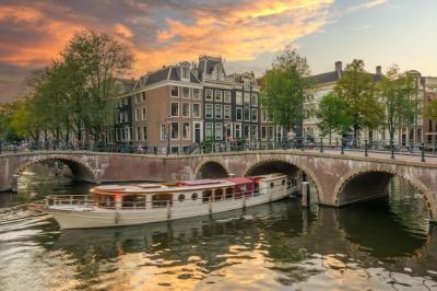 Pleasure Boat Under the Amsterdam Bridge – Free Download