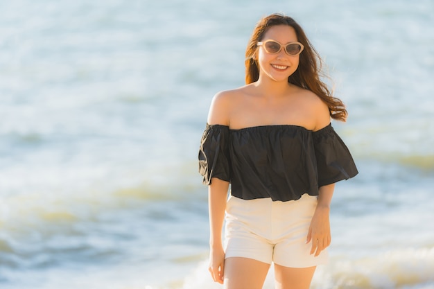 Beautiful Young Asian Woman Smiling at the Beach – Free Stock Photo for Download