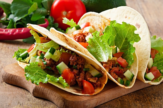 Delicious Mexican Tacos Loaded with Meat, Vegetables, and Cheese – Free Download