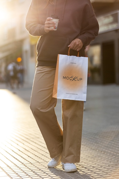 Woman Holding Shopping Bag Outdoors – Free Stock Photo Download