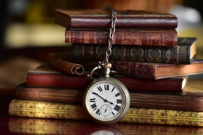 Close-Up of Old Books and Pocket Watch on Table – Free Stock Photo for Download