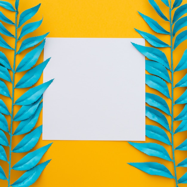 Exotic Tropical Leaves and Blank Paper on Yellow – Free to Download