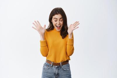 Excited Girl Expressing Joy Over Special Offer – Free Stock Photo Download