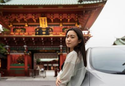 Woman Posing Next to Her New Electric Car – Free Stock Photo for Download