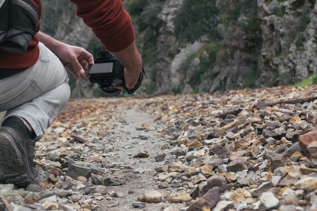 Young Photographer Capturing Moments on a Stone Path – Free Stock Photo, Download for Free