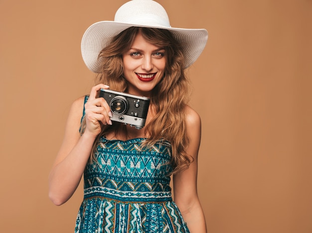 Cheerful Young Woman in Summer Dress Taking Photos with Retro Camera – Free Stock Photo Download