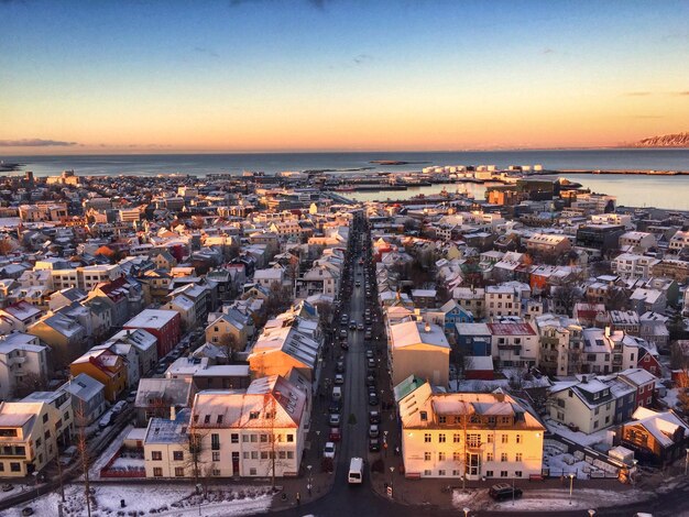 Aerial View of Town by Sea at Sunset – Free to Download