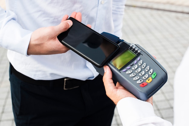 Businessman Making a Payment by Phone – Free Stock Photo, Download Free