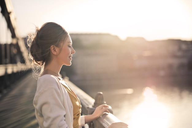 Young Woman on a Bridge at Sunset – Free Stock Photo Download