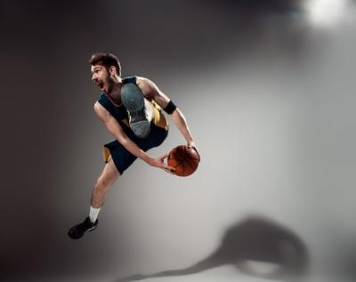 Full Length Portrait of a Basketball Player with Ball – Free Download