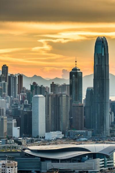 Skyscrapers in Hong Kong at Sunset Under an Orange Sky – Free to Download