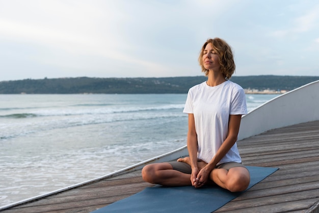 Yoga Pose by the Sea – Free Stock Photo for Download