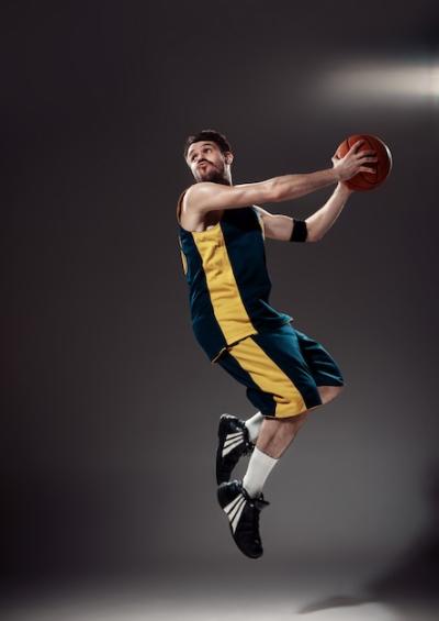 Full Length Portrait of a Basketball Player with Ball – Free Download