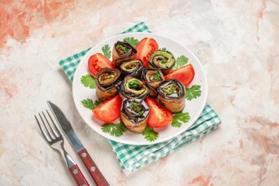 Delicious Top View of Eggplant Rolls with Tomatoes and Greens – Free to Download