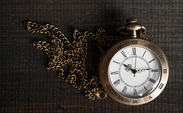 Antique Pocket Watch on Black Wooden Background – Free Download