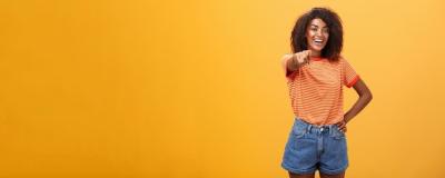 Confident Happy Dark-Skinned Fashionable Woman Pointing at Camera – Free Stock Photo for Download