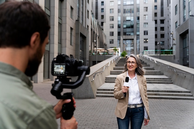 Female Journalist Conducting an Interview – Free Stock Photo Download