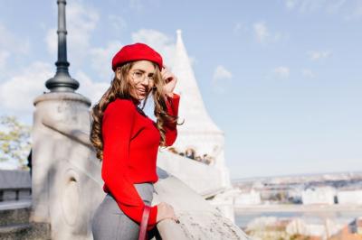 Charming French Girl in Glasses Embracing Sunlit Town Views – Free Download