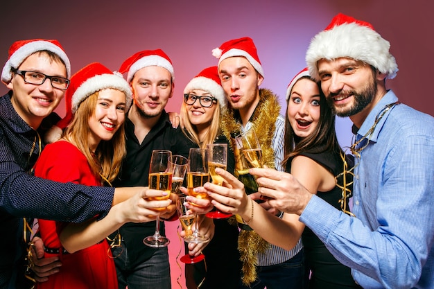 Young Women and Men Enjoying a Christmas Party – Free Stock Photo, Download for Free