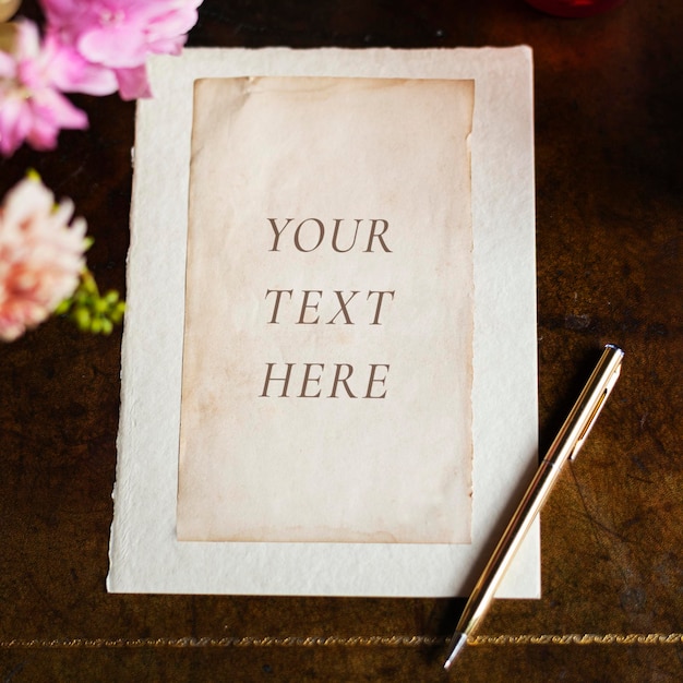 Vintage Paper Mockup on a Wooden Table with Flowers – Free Download