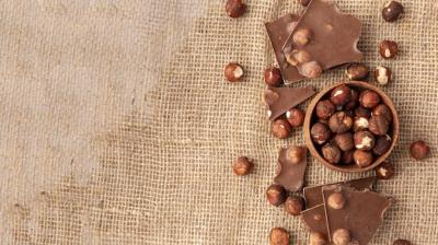 Chocolate with Hazelnuts on Burlap – Free Stock Photo for Download