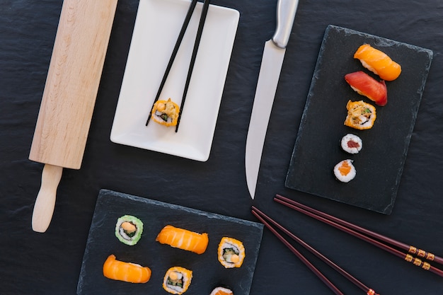 Knife and Chopsticks Next to Sushi – Free Stock Photo for Download