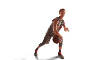 Dynamic Basketball Player in Action During Sunset – Free Download