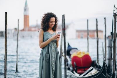 Woman with Phone Enjoying Vacation in Venice – Free Download