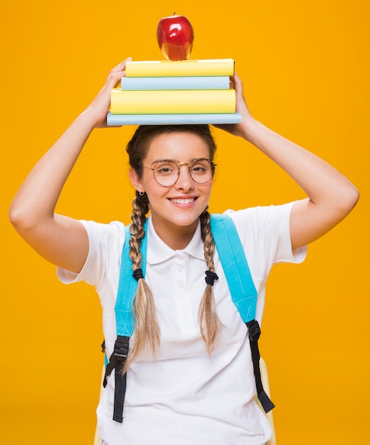 Portrait of Schoolgirl on Yellow Background – Free Download