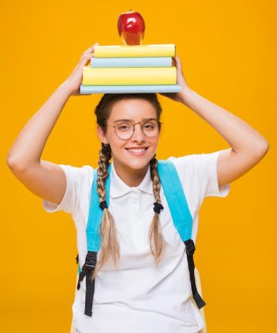 Portrait of Schoolgirl on Yellow Background – Free Download