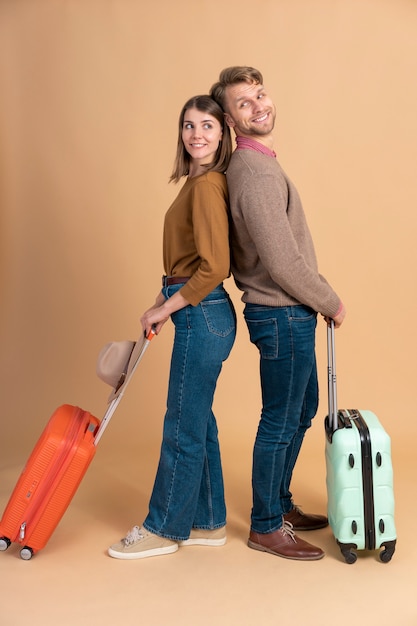 Young Couple Preparing for Travel with Luggage – Free Download