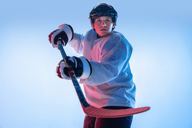 Youth: Young Male Hockey Player in Neon Light – Free Download