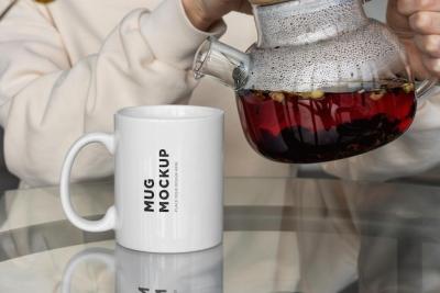 A Stunning Mug Mockup on the Table with Teapot – Free to Download