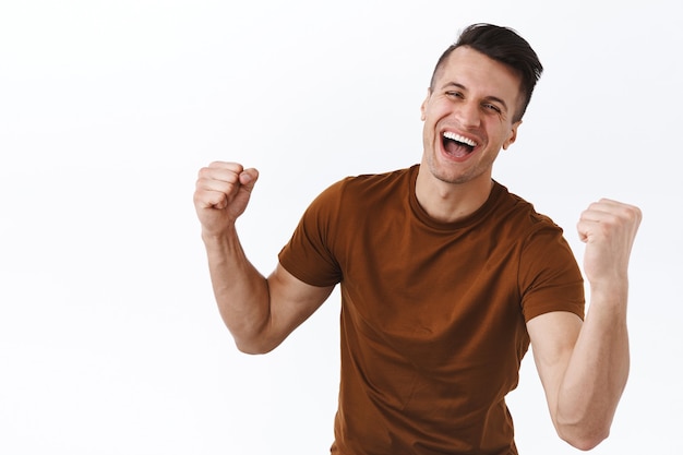 Triumphant Athletic Guy Celebrating Victory – Free Stock Photo for Download