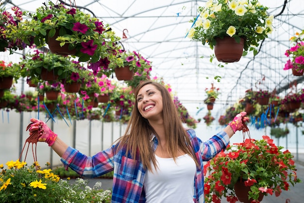 Beautiful Woman Working with Flowers – Free Stock Photo for Download