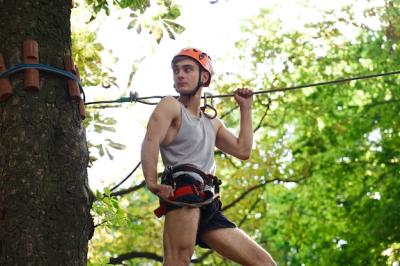 Ready to Climb: Man in an Orange Helmet | Free Stock Photo for Download