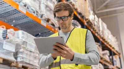 Man Working with Tablet in Logistics – Free Download