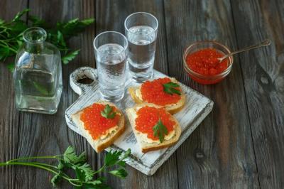 Alcoholic Drink with Salmon Caviar and Bread Toast on Wooden Wall – Free to Download