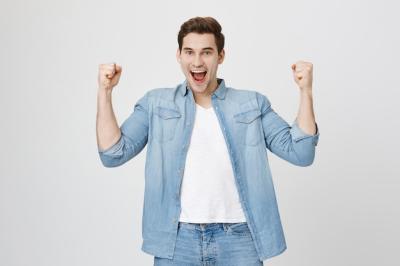 Excited Happy Young Man Achieving Success with Fist Pump – Free Stock Photo, Download for Free