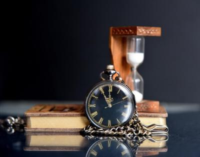 Close-up of an Antique Pocket Watch on Table – Free Download