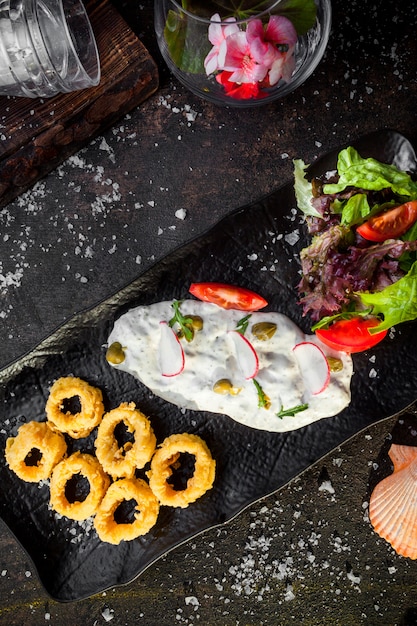 Top View of Squid Rings in Batter with Sauce and Fresh Vegetable Salad – Free Download