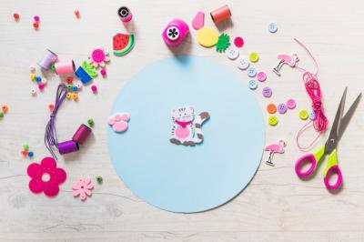 Cat and Paw Sticker on Blue Circular Paper with Decorative Items – Free Stock Photo Download